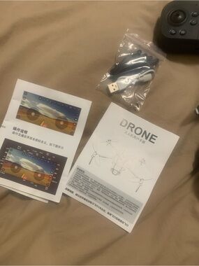 Black VR/Drone Controller with USB Cable and Spare Propellers